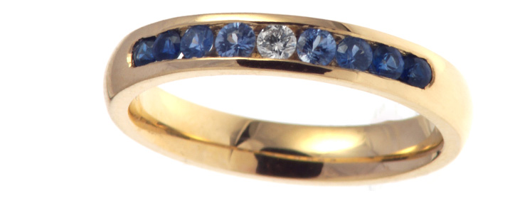 Gold Sapphire Graduating Eternity Ring