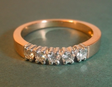 18ct rose gold ring with 5 brilliant cut HSI diamonds.