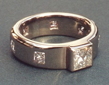 18ct white gold engagement ring with princess cut diamonds.