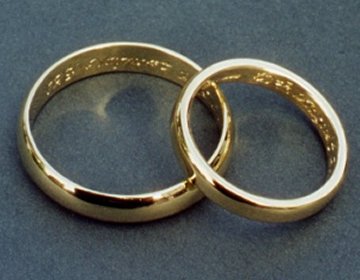 Pair of 18ct yellow gold wedding bands with engraving on the inside.