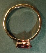 9ct yellow gold engagement ring with a peardrop shaped garnet