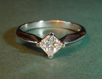 A platinum and diamond engagement ring