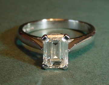 A platinum and diamond engagement ring