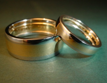 A platinum and 18ct yellow gold pair of wedding rings