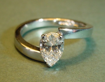 A platinum and diamond engagement ring