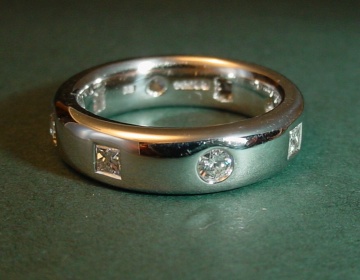 A platinum and diamond eternity ring