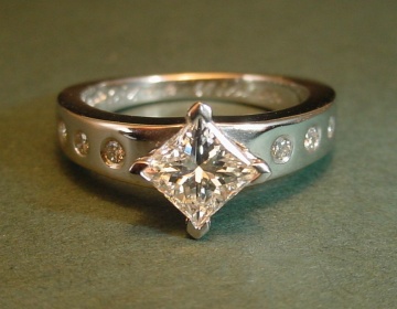 A platinum and diamond engagement ring