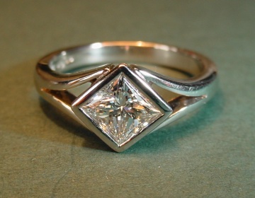 A platinum and diamond engagement ring