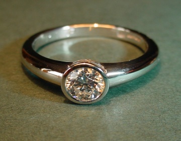 A platinum and diamond engagement ring