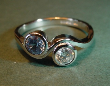 A platinum, sapphire and diamond engagement ring