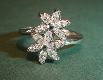 A platinum and diamond engagement ring inspired by interlocking flowers