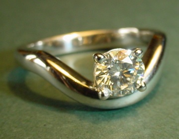 A platinum and diamond engagement ring