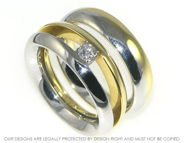 18ct white and yellow gold engagement and
wedding ring set with an HSI diamond 