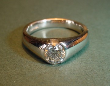 Platinum solitaire with open sided setting for G SI 0.61cts brilliant cut diamond