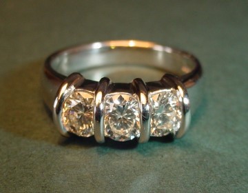 Platinum 3 stone engagement ring with brilliant cut diamonds totalling 1ct