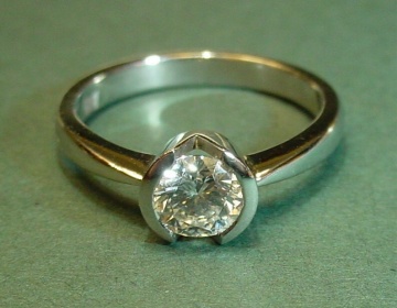 Platinum ring with 0.55cts diamond in open sided setting