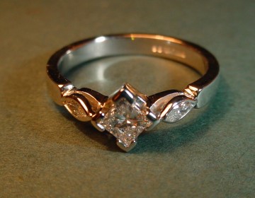 Delicate platinum ring with princess and marquise cut diamonds.