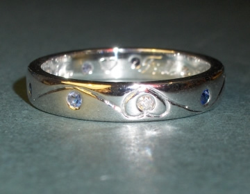 18ct white gold wedding ring with diamonds and sapphires.