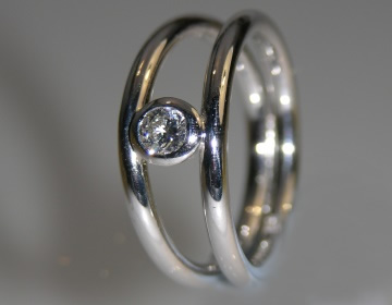 Simple 0.21cts double banded diamond solitaire