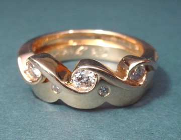 Yellow gold and diamond engagement ring with a fitted wedding ring