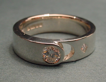 Bespoke diamond and white gold ring with moon cut-out symbol