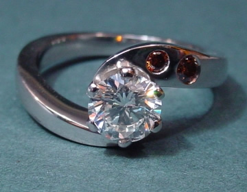 Platinum engagement ring with white and chocolate cognac diamonds