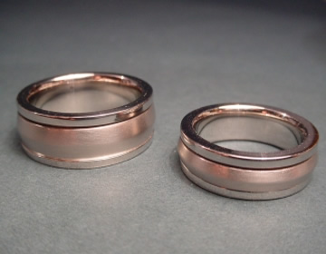 Platinum wedding rings with an apex shaped rotating satinised center