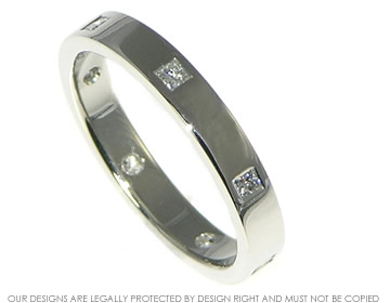 Platinum eternity ring with evenly spaced princess cut diamonds  