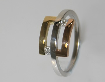 3 colours of gold ring with 2 brilliant cut diamonds.