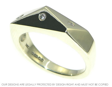 Abstract white gold ring with 3 invisibly set diamonds