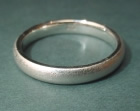 white gold wedding ring with a tunstall finish