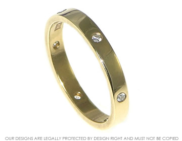 Simple 9ct yellow gold ring with 6 invisibly set diamonds equally spaced around the band