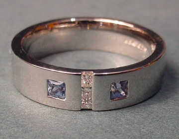 Flush set art deco influenced platinum diamond and sapphire ring