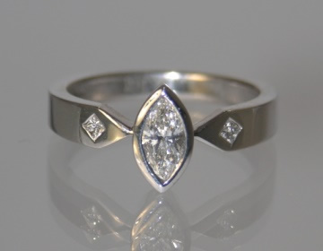 18ct white gold engagement ring with marquise cut diamond.