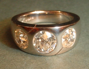 Platinum engagement ring with customer's own diamonds.