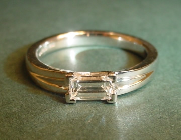 Platinum solitaire with unusual 0.43cts baguette cut diamond