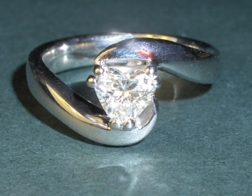 9ct white gold twist and heart shaped diamond engagement ring.