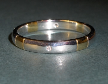 Bespoke wedding ring in mixed golds with diamonds.