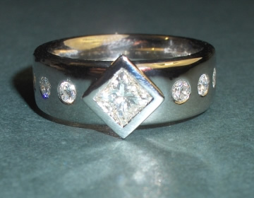 Combined wedding/engagement/eternity ring with Kate's own diamonds.