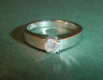 Commissioned platinum and diamond solitaire engagement ring 