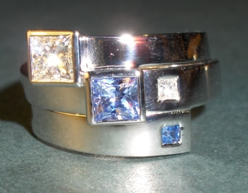 18ct white gold fitted wedding ring with a diamond and sapphire.