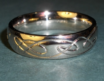 18ct white gold wedding ring with engraved Celtic knots.