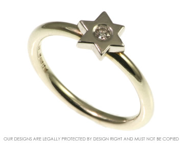 Delicate white gold star ring with brilliant cut diamond