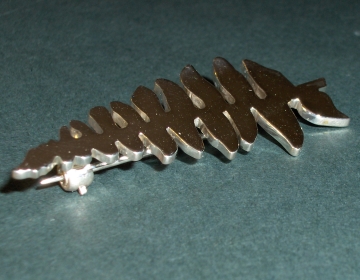 Bespoke silver sickle fern brooches