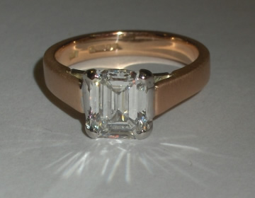 Bespoke engagement ring in satinised rose gold and polished platinum