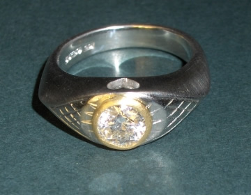 Bespoke platinum and yellow gold angel inspired engagement ring.