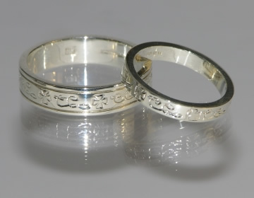 Bespoke white gold rings with engraved details