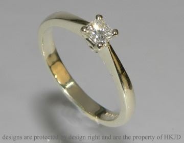 Classic style white gold princess cut diamond solitaire.