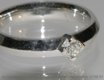 Bespoke 18ct white gold apex engagement ring with a brilliant cut diamond