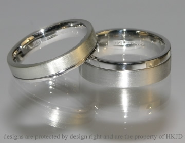 A pair of commissioned wedding rings with engraving and satin finish